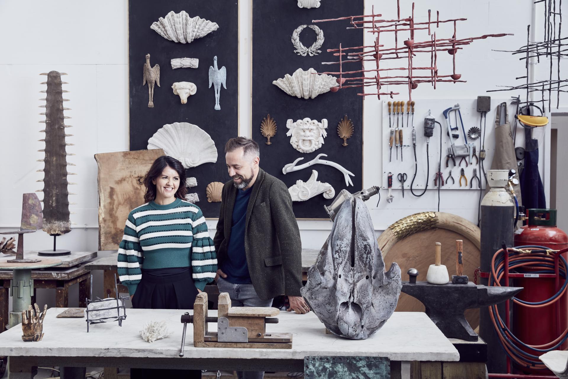 Artists in a studio surrounded by sculptures and tools, celebrating creativity for London Craft Week 2019.