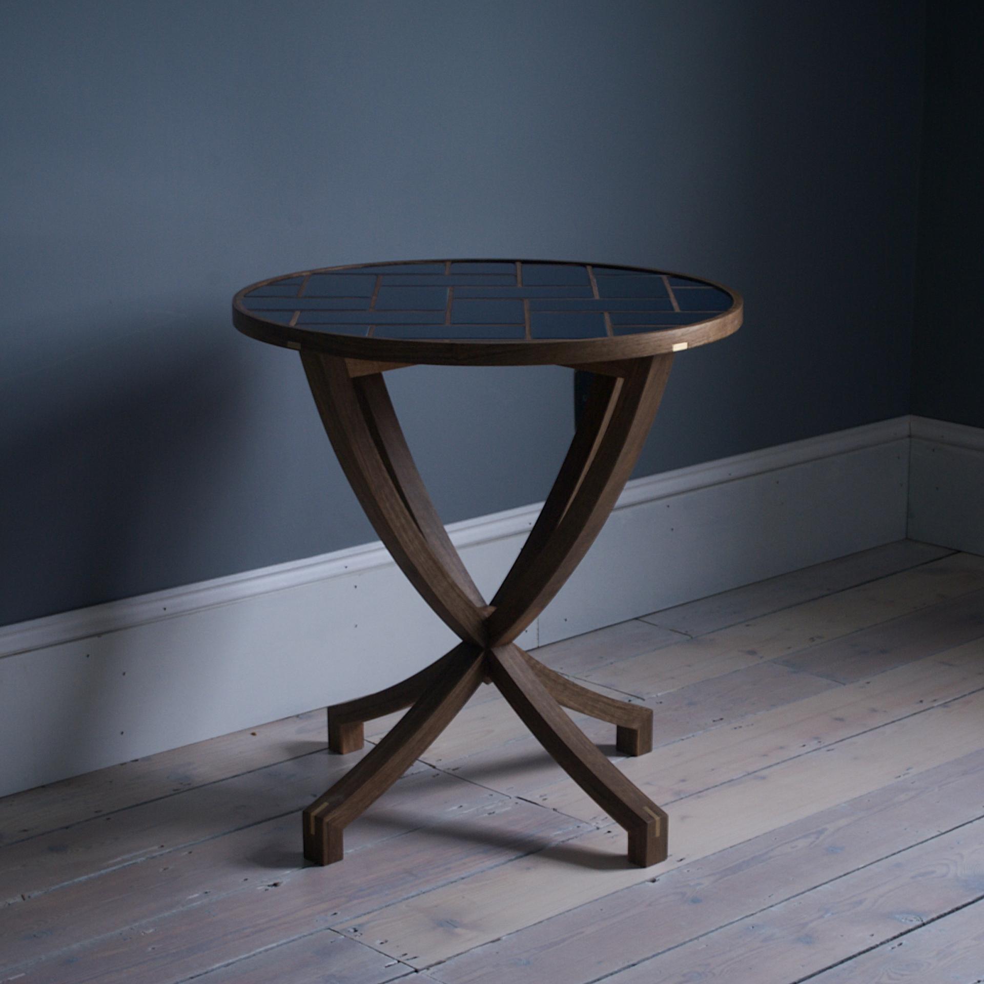 Contemporary wooden side table with a unique rounded design, showcasing material sustainability and elegant craftsmanship in a serene interior.