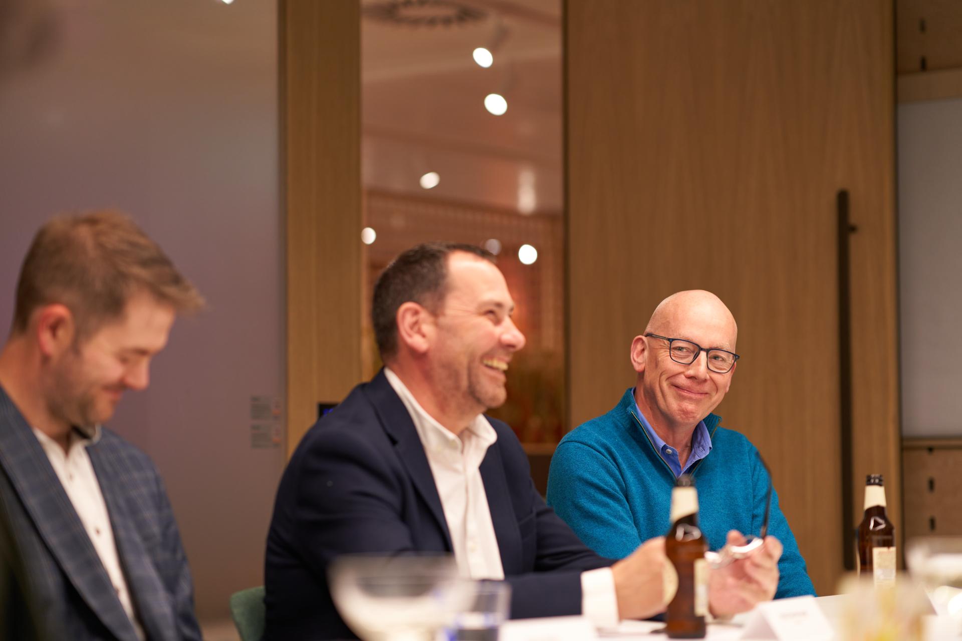 Professionals engaged in discussion during the Glasgow Property Outlook seminar at Material Source Studio.