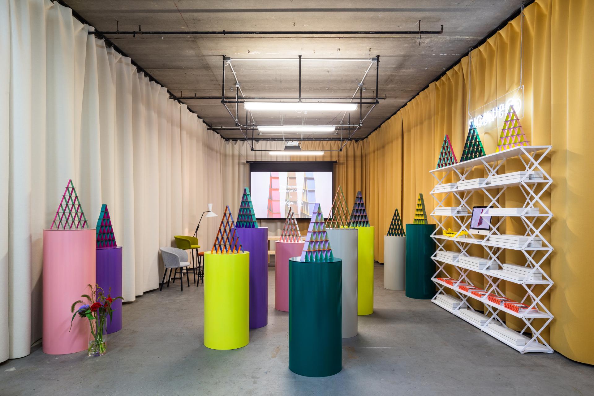 Colorful cylindrical displays with geometric designs are showcased in Hem's installation at the Redchurch Room during LDF19.