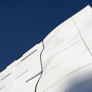 Innovative curved Corian® facade showcasing modern design possibilities for 3D fabrication solutions in architecture.
