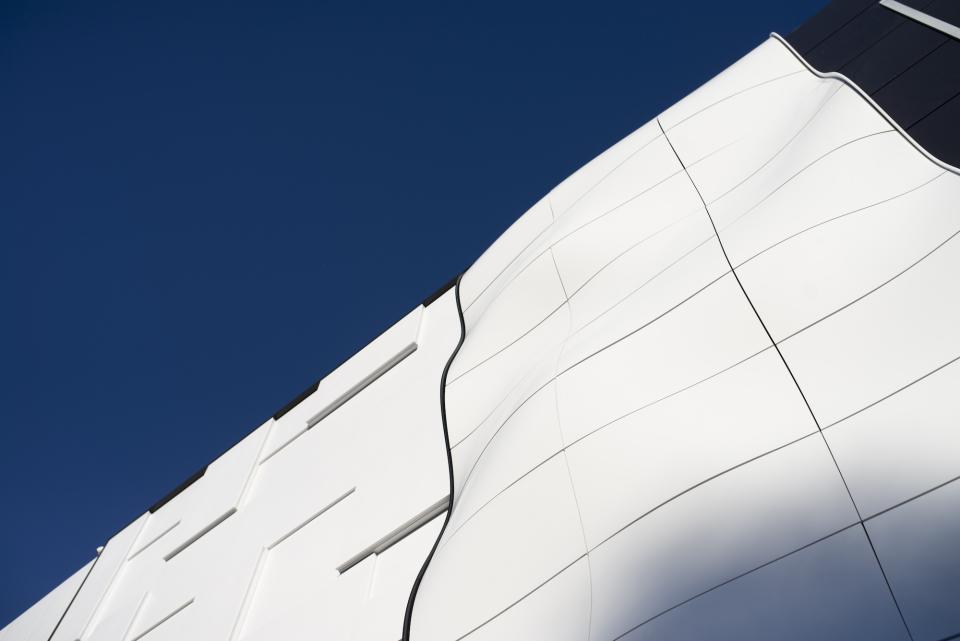 Innovative curved Corian® facade showcasing modern design possibilities for 3D fabrication solutions in architecture.