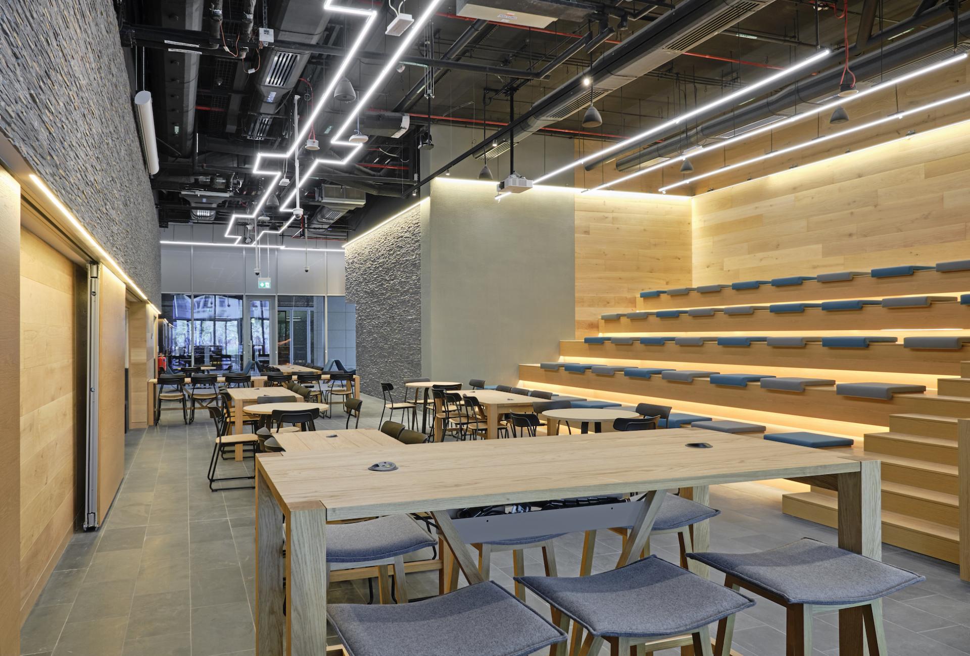 Modern learning space at Heriot-Watt University's Dubai campus featuring collaborative seating, natural light, and contemporary design.