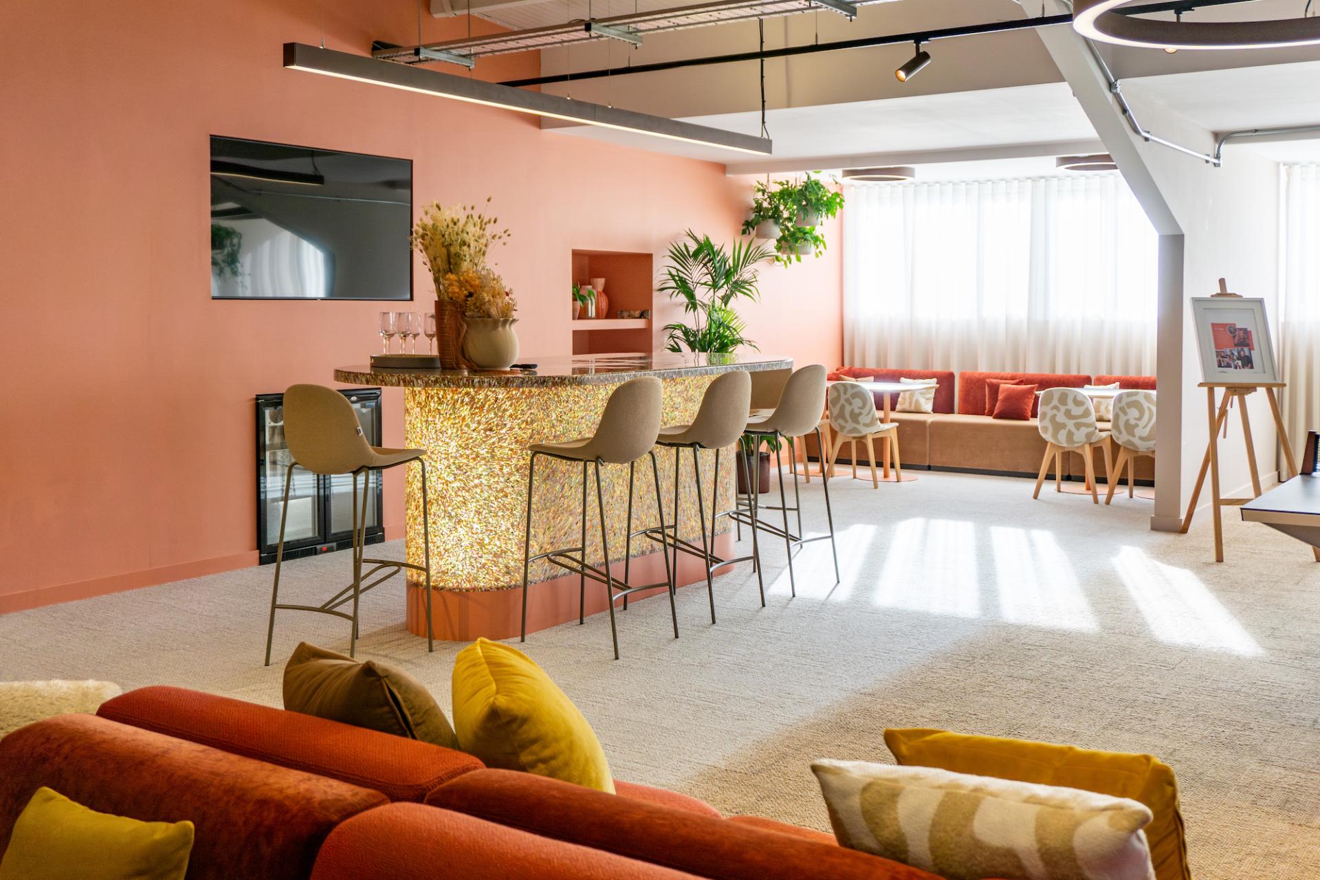 Vibrant lounge area in the Liz Hickson Academy featuring a bar, seating, and natural light, promoting collaboration and wellbeing.