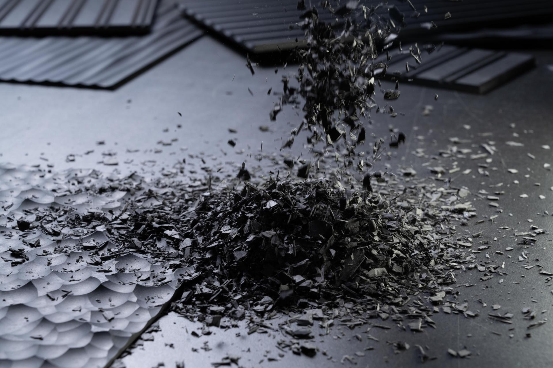 Textures of recycled materials scattered across a surface, highlighting Surface Matter's circular Material Rescue initiative.