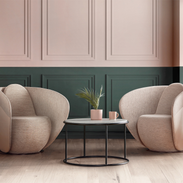 Rounded cocoon chairs from Gresham’s Relo collection in a calming workspace, complemented by a stylish side table and lamp.