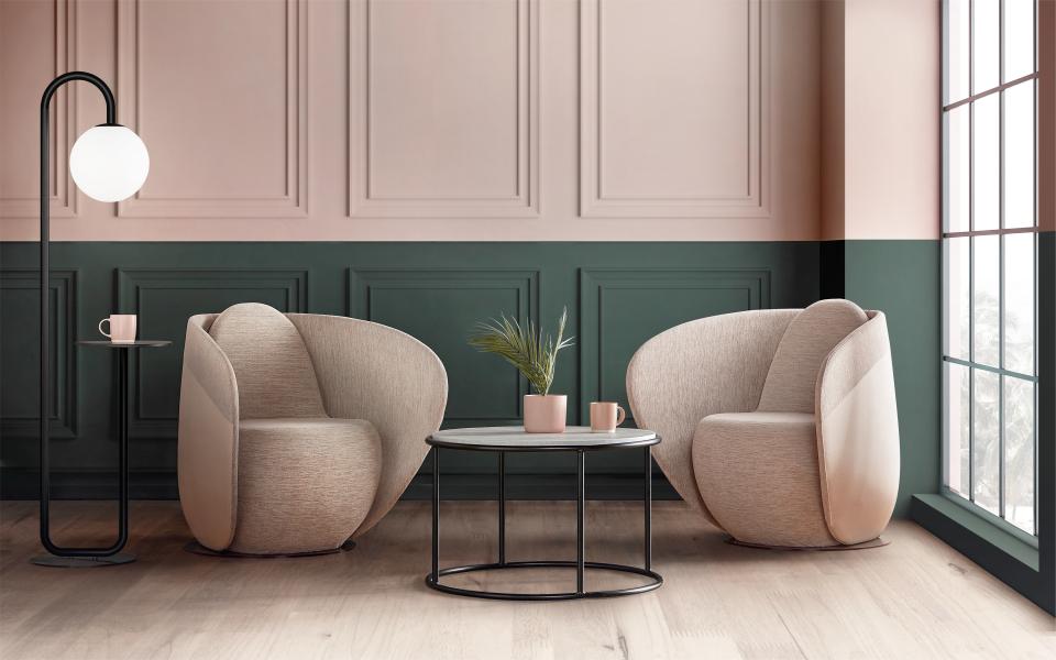 Rounded cocoon chairs from Gresham’s Relo collection in a calming workspace, complemented by a stylish side table and lamp.