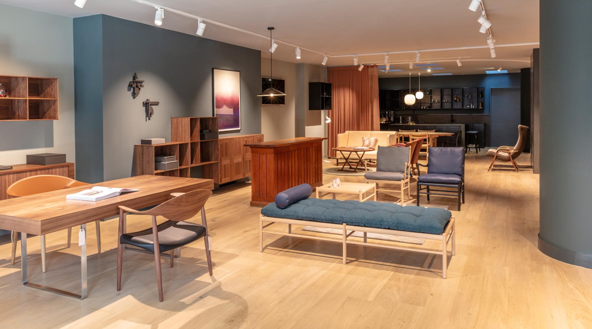 Modern Scandinavian furniture displayed in Carl Hansen & Son's London flagship store, showcasing minimalist design and elegant decor.