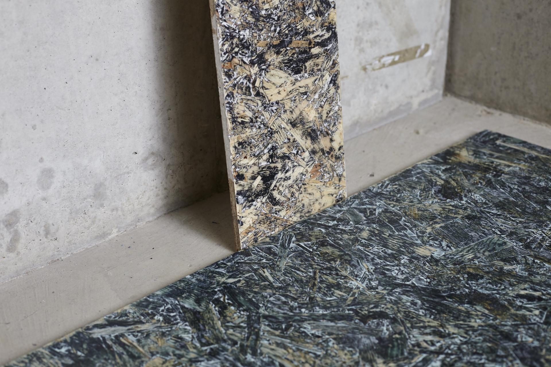 Textured flooring and panel samples displayed at Surface Design Show 2019, showcasing innovative material design and sustainability.