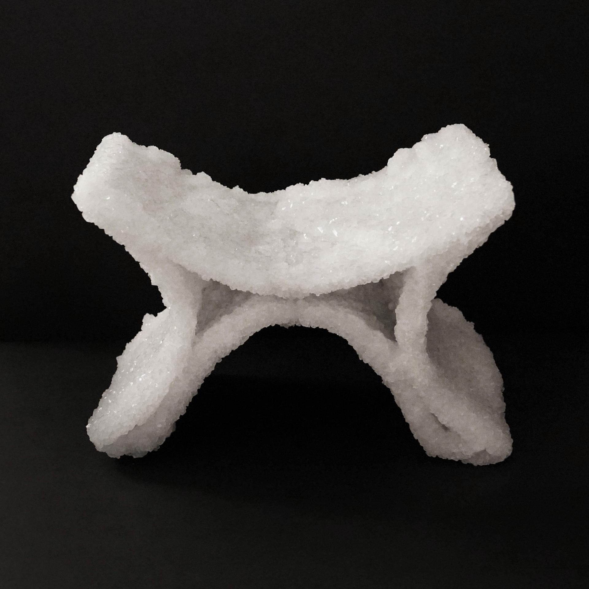 Artistic sculpture made of crystalline material, showcasing innovative design at New Designers 2024 exhibition.