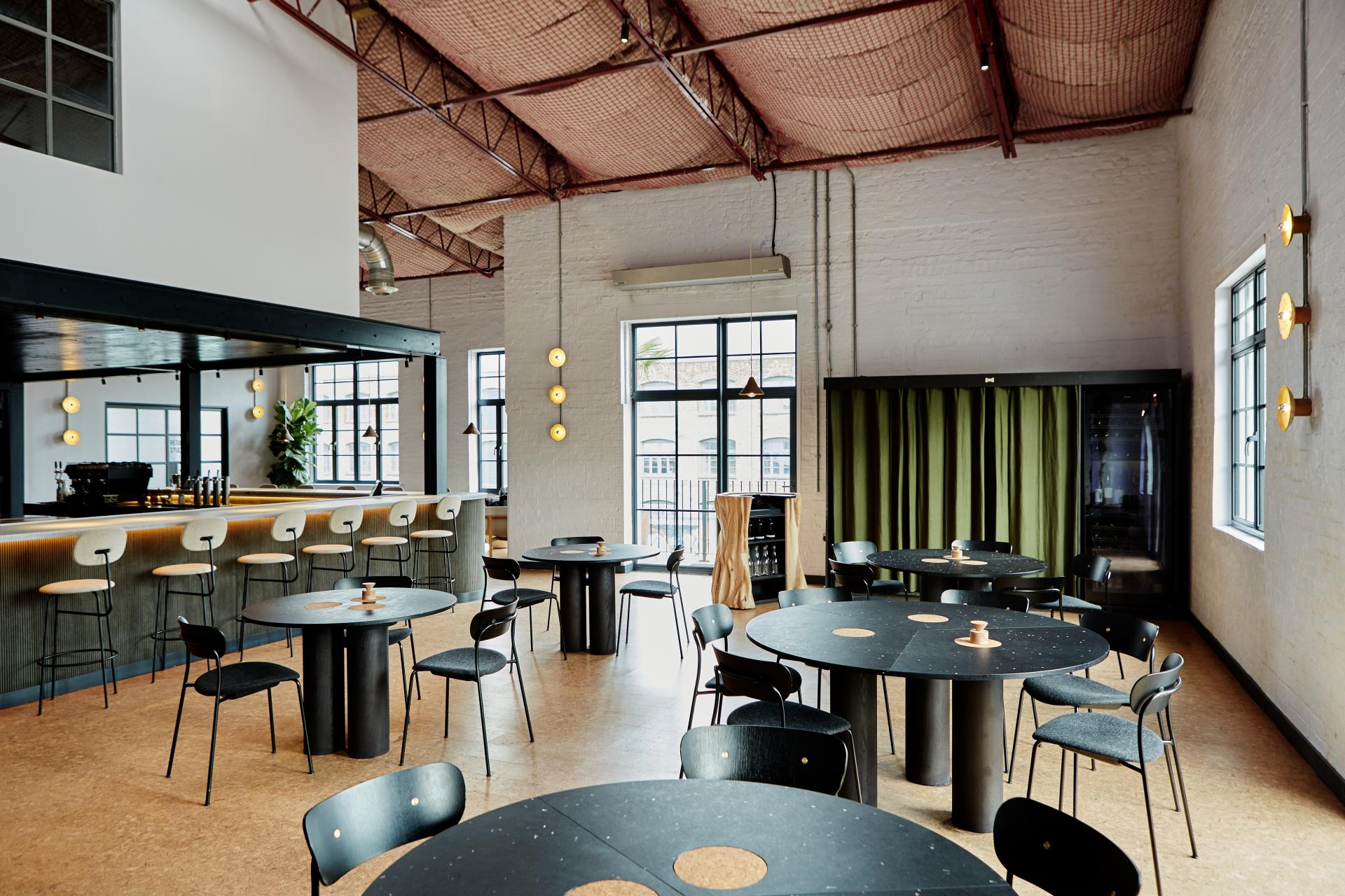 Modern interior of Silo, a zero-waste restaurant designed by Nina+Co, featuring stylish furniture and a welcoming atmosphere.