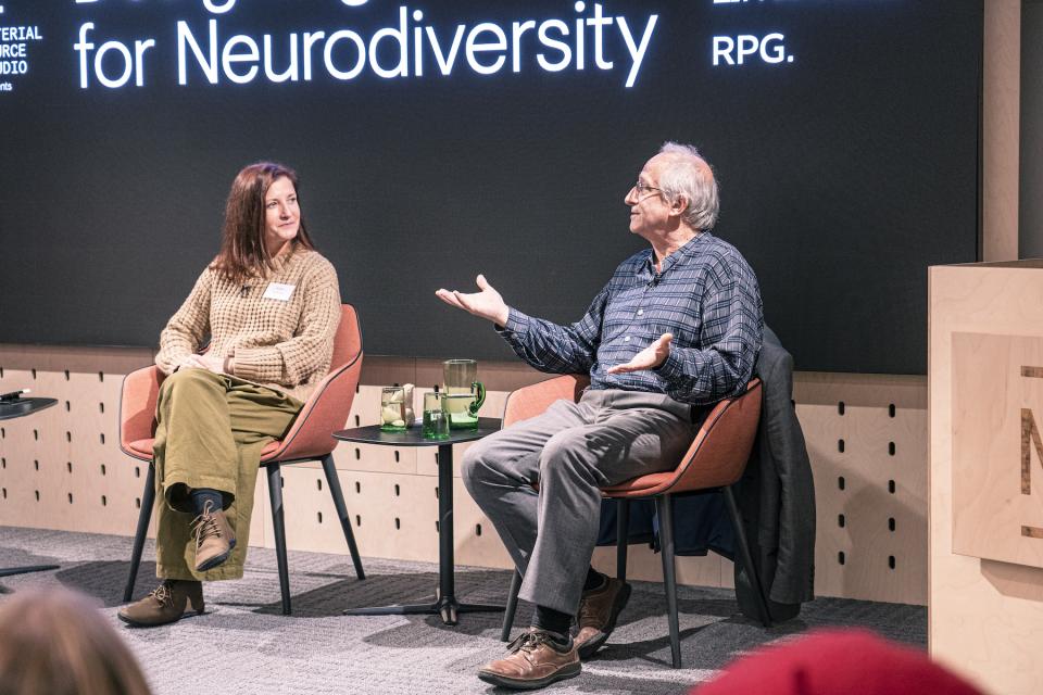 Panel discussion on neurodiversity featuring two speakers engaged in an interactive conversation at Material Source Studio event.