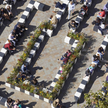 Visitors engage in relaxation and meditation within the floral pathways of the Life Labyrinth at London Design Festival 19.