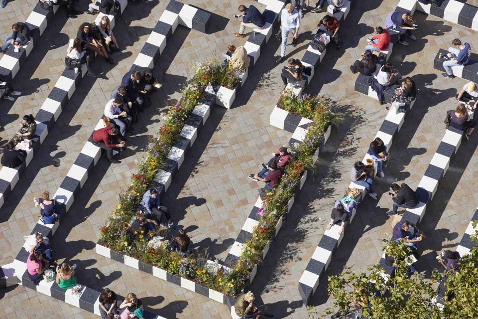 Visitors engage in relaxation and meditation within the floral pathways of the Life Labyrinth at London Design Festival 19.