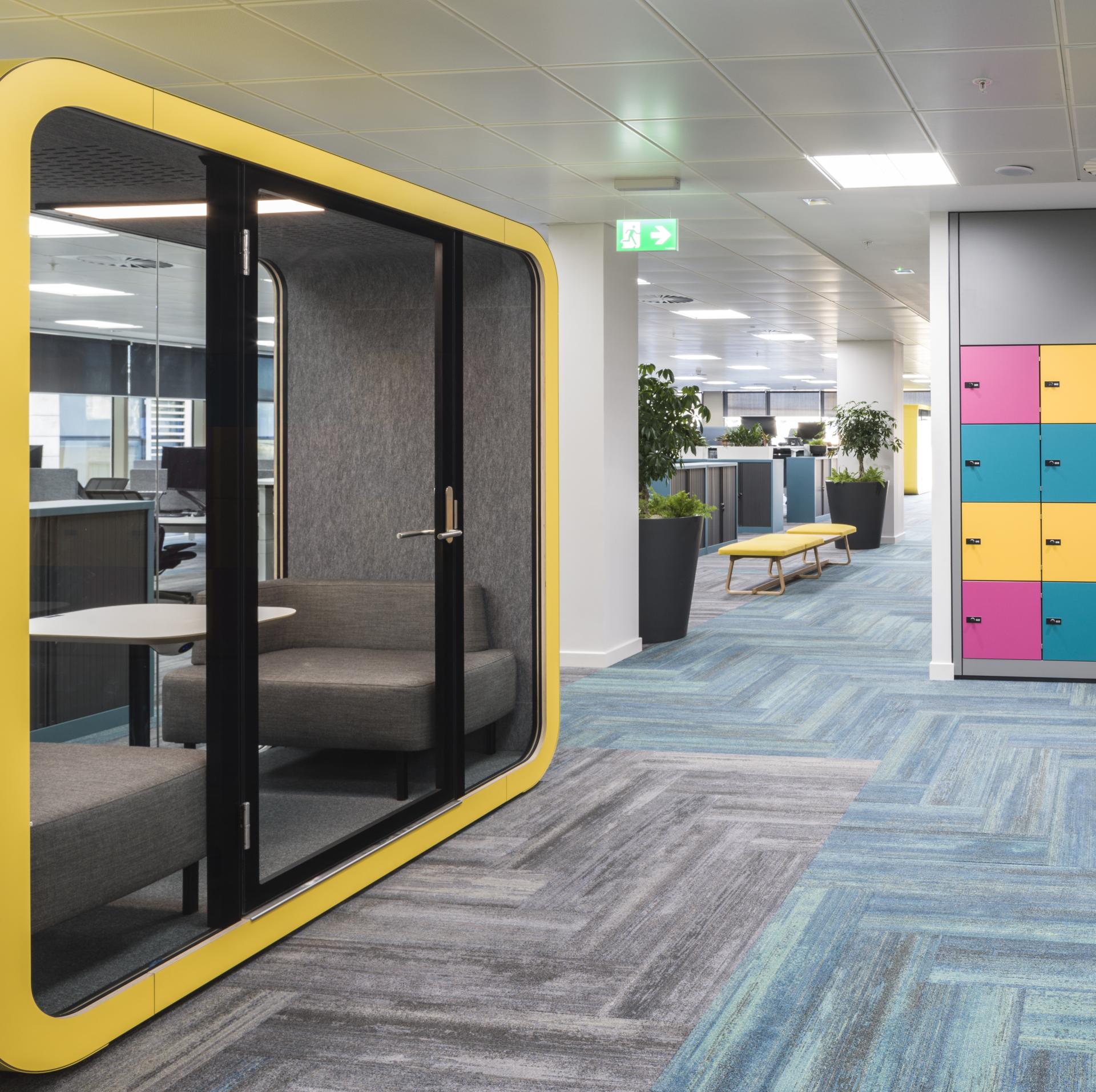 Modern office interior featuring collaborative workspace, WELL certified design elements, and vibrant locker storage in Edinburgh.