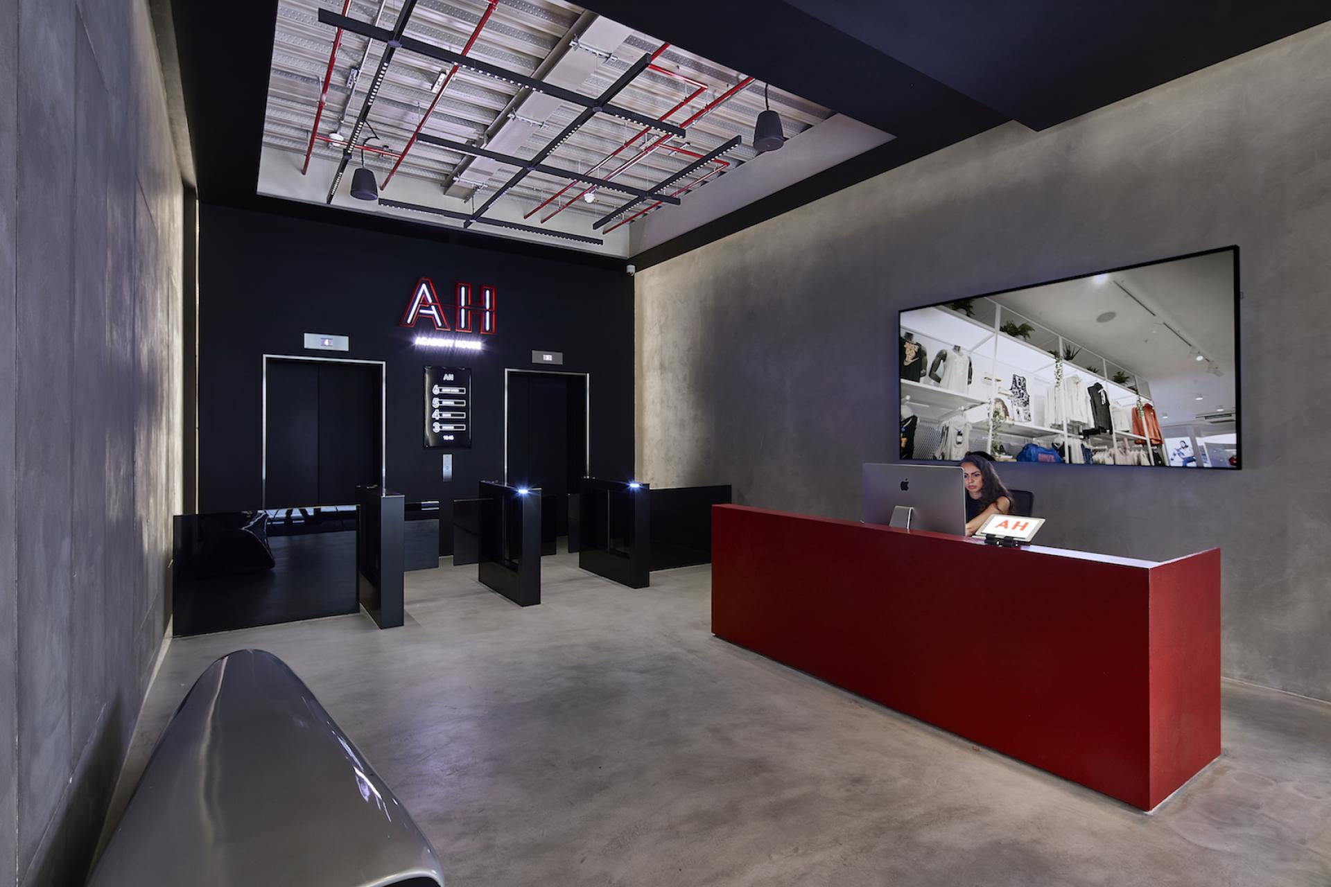 Modern reception area of Sports Direct International's London offices, featuring sleek design and a welcoming atmosphere.