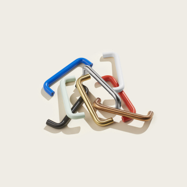 Colorful pull-handles designed by d line and &Shufl, showcasing a mix of playful designs and finishes.