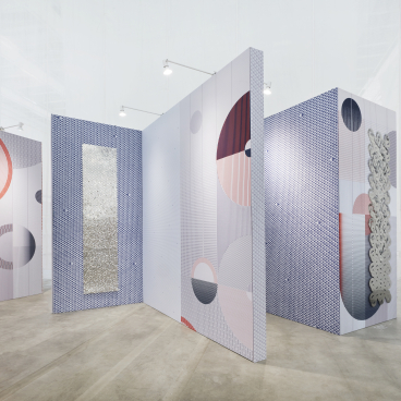 Colorful geometric panels create a serene atmosphere in Alissa & Nienke’s exhibit at Dutch Design Week.