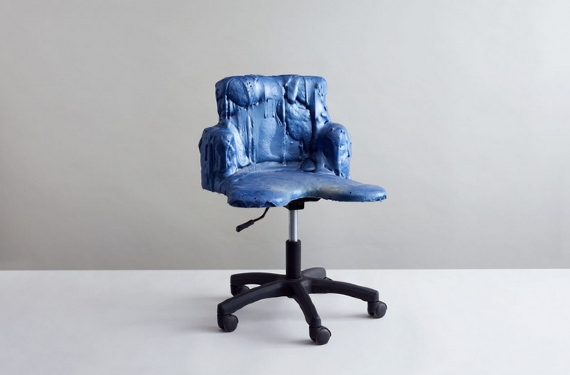 Blue sculptural chair with a drip effect, part of the 'Re-Use, Re-Think, Re-Imagine' exhibition at Hauser & Wirth.