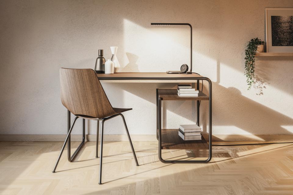 Stylish Triennale S 661 chair next to a modern wooden desk, showcasing organic design and interior decor elements.