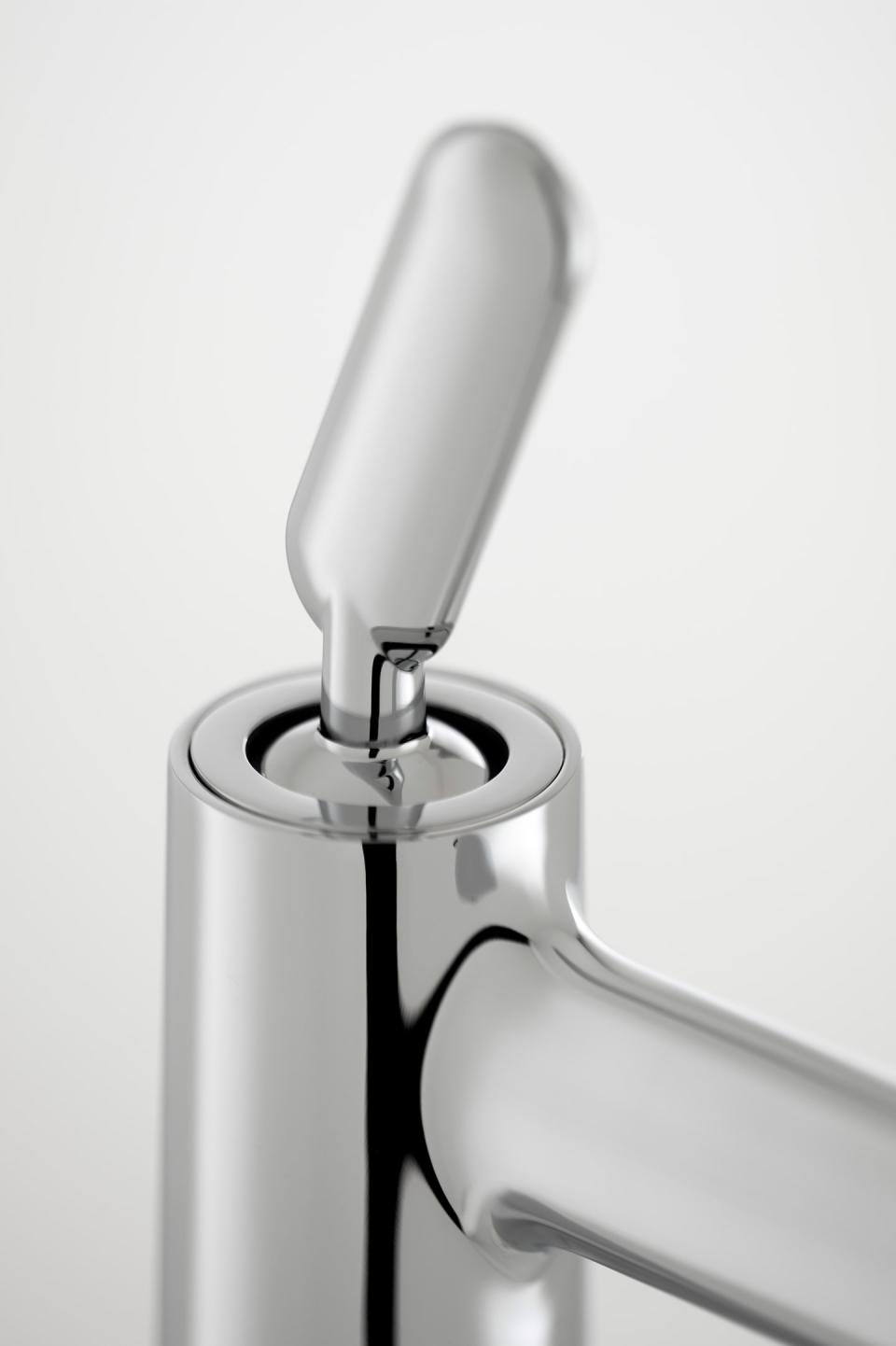 Sleek chrome faucet design featuring a modern lever handle, showcasing VADO and Conran and Partners' collaboration on innovative interiors.