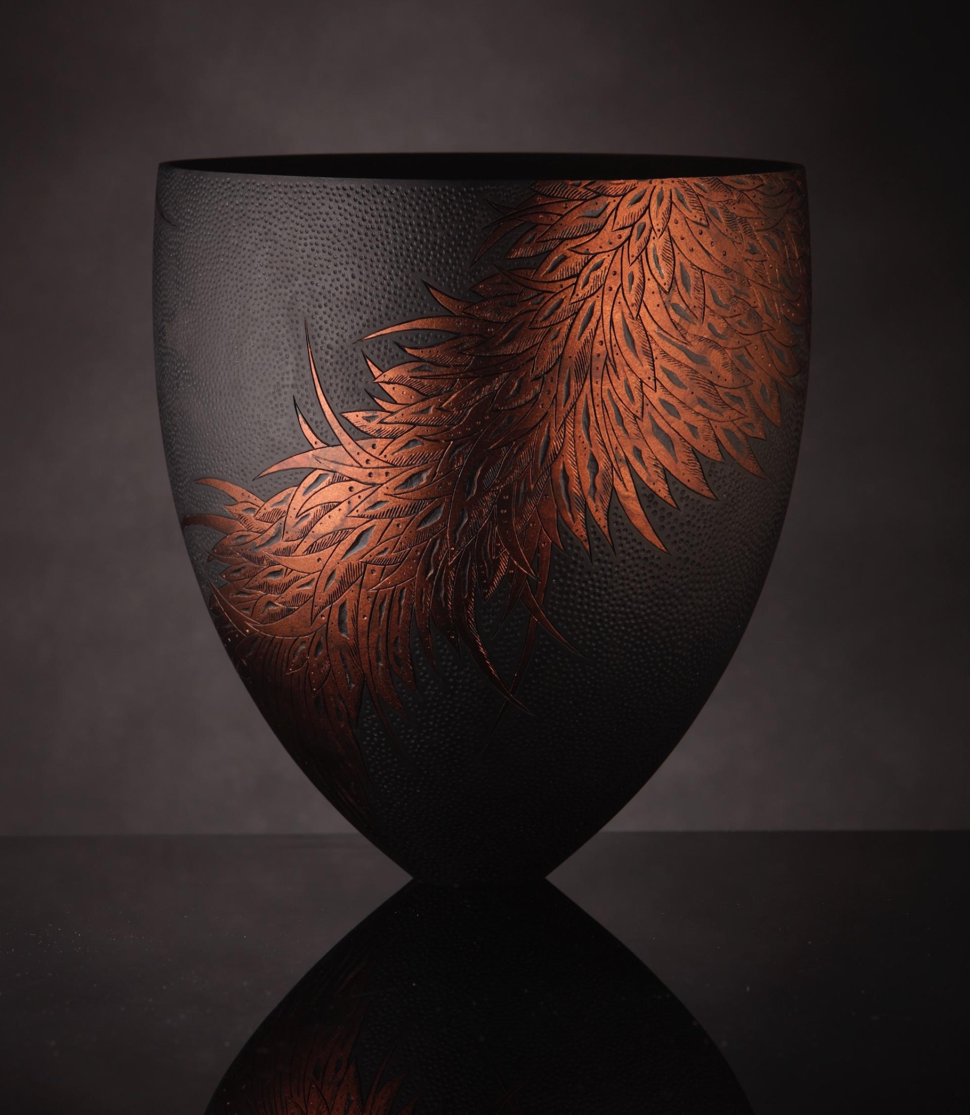 Contemporary black vase featuring intricate copper leaf design, showcasing creative craftsmanship from the North West England.