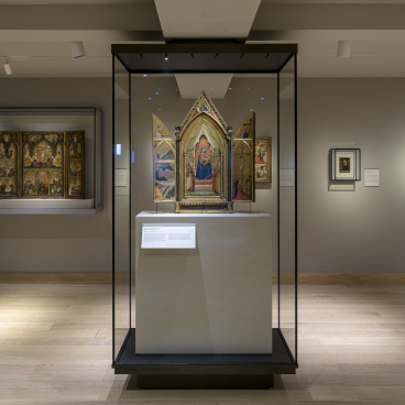 Historic artwork displayed in glass cases at The Courtauld Gallery after its recent redesign.