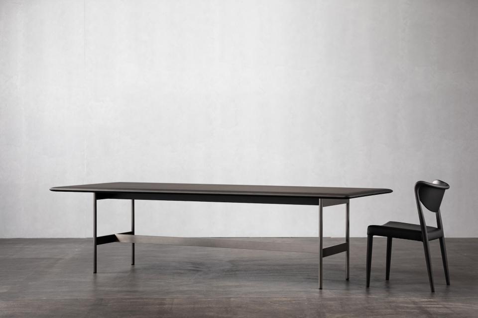 Modern minimalist dining table and chair showcasing Ritzwell's blend of Japanese design and functionality.