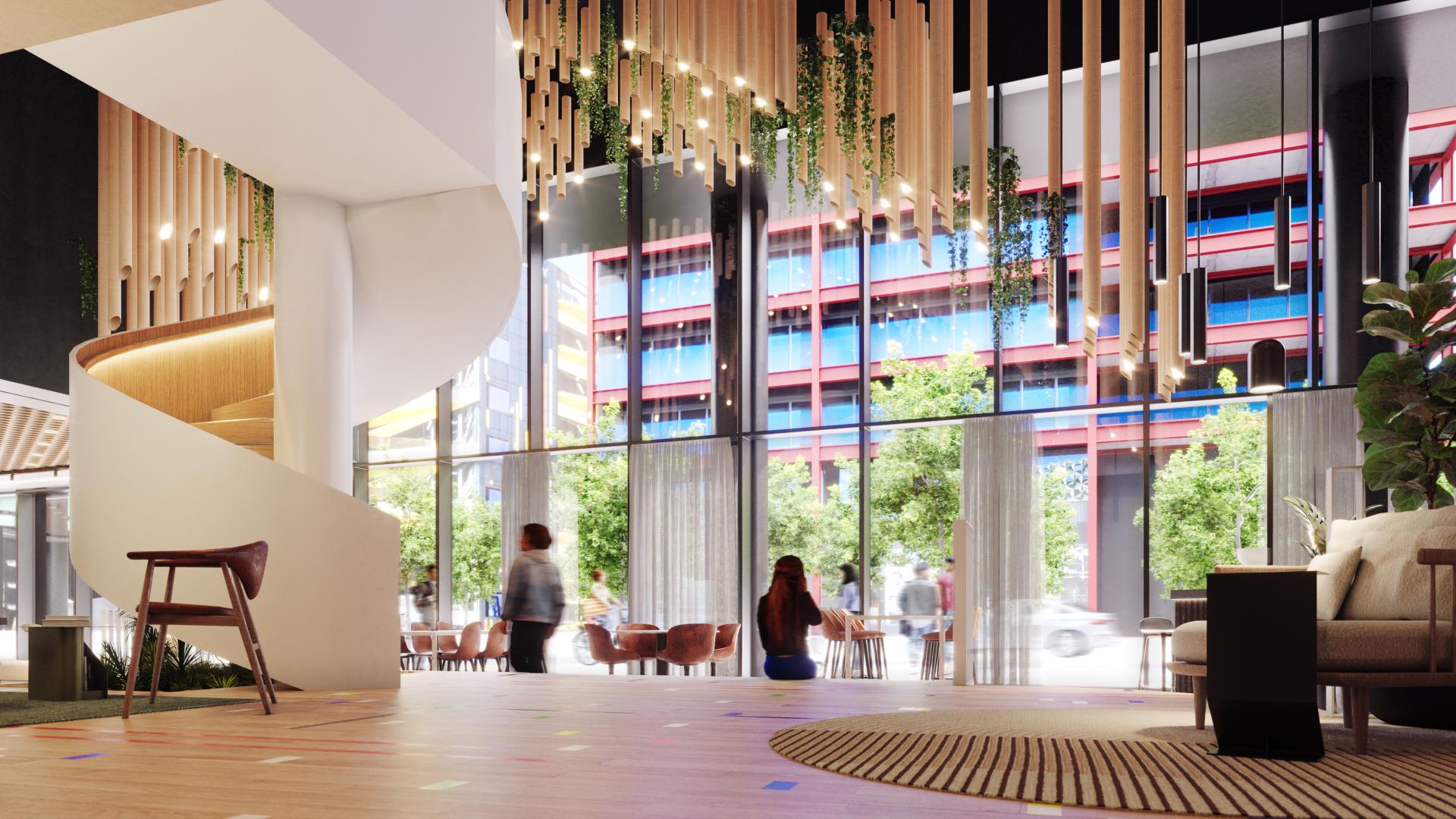 Spacious interior of Eden featuring a spiral staircase, natural lighting, and sustainable design elements in Manchester.