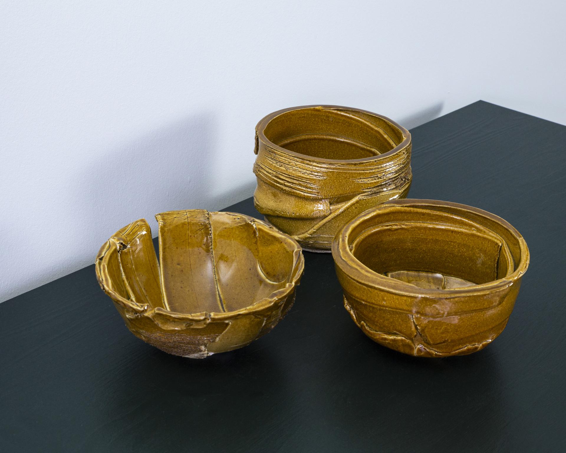 Unique, handcrafted ceramic bowls by designer Ewan Crallan, showcasing playful yet purposeful craftsmanship and artistic flair.