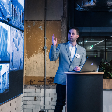 Nick Hurst presents innovative 3D printing concepts for sustainable construction at a Full Circle Concrete exhibition.