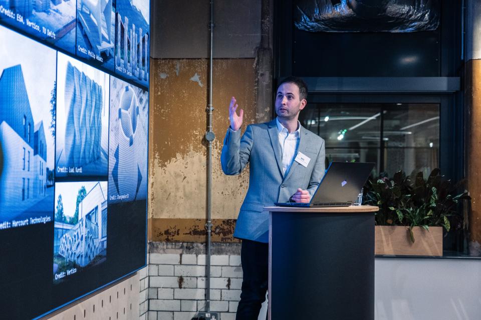 Nick Hurst presents innovative 3D printing concepts for sustainable construction at a Full Circle Concrete exhibition.