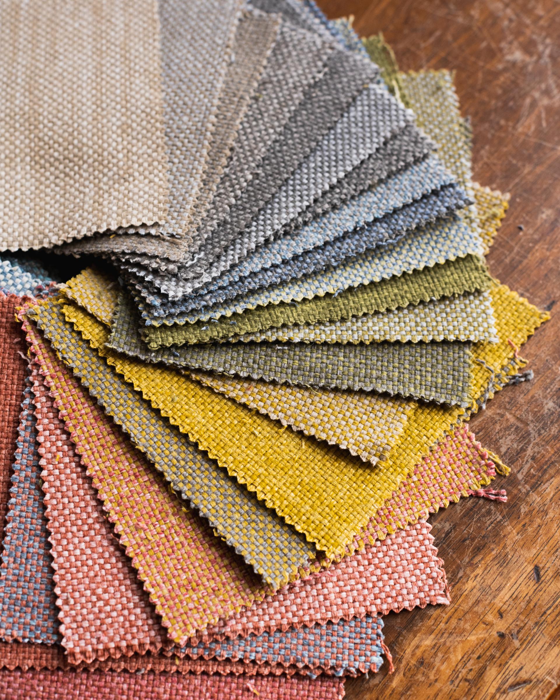Colorful fabric swatches from Agua's VerdEco collection made from 100% upcycled textile waste, showcasing sustainable design.
