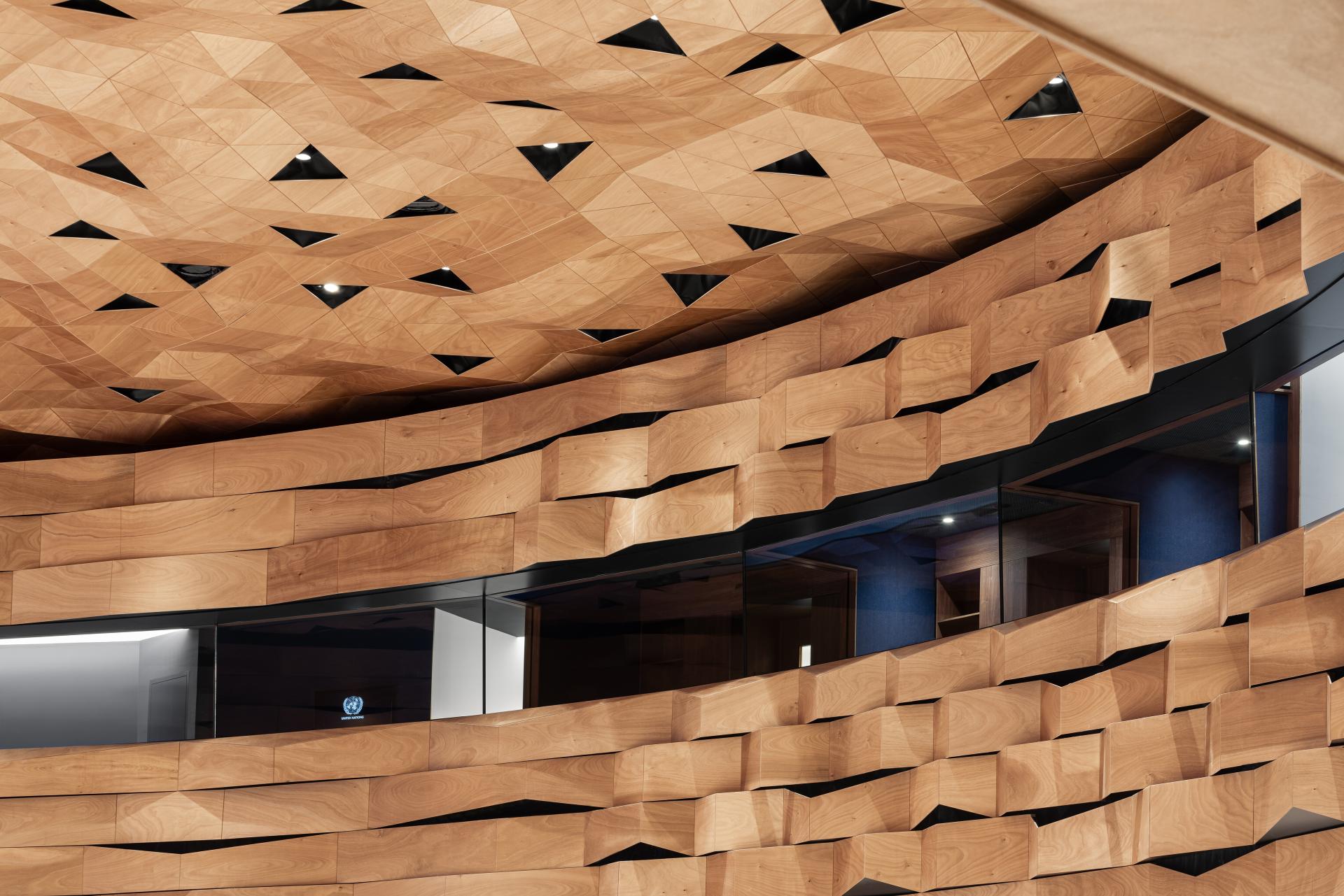 Elegant wooden panels create a textured design on the walls and dome of the Assembly Hall in Geneva.