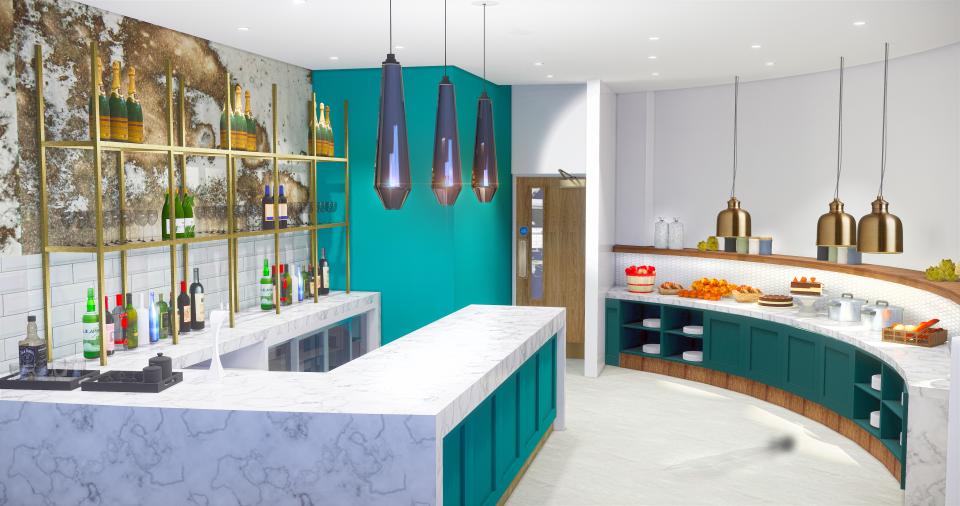 Stylish interior design of a modern bar featuring green accents, marble countertops, and elegant lighting in Manchester T2 lounge.