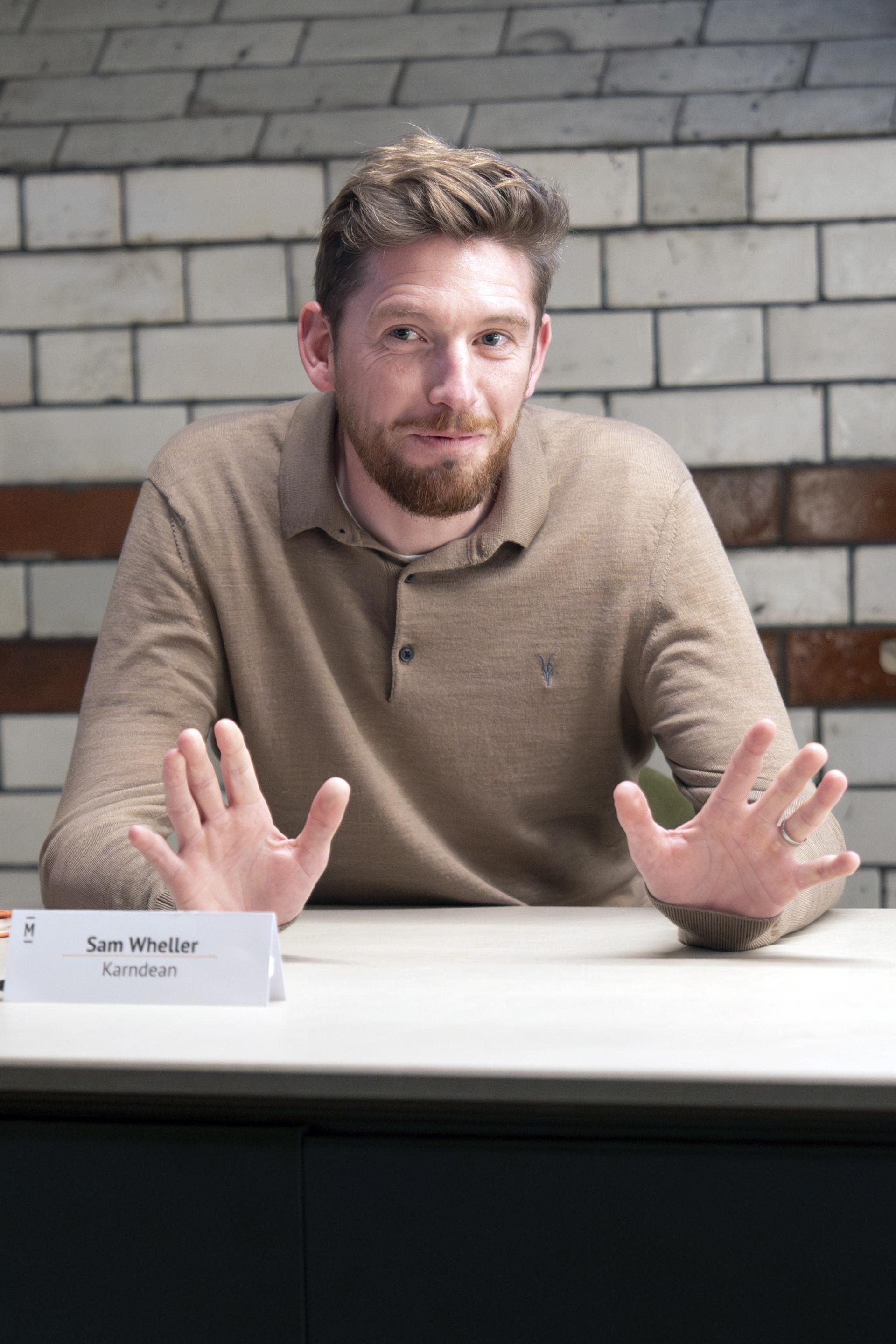 Sam Wheller from Karndean gestures during a roundtable discussion about Manchester's residential property mix.