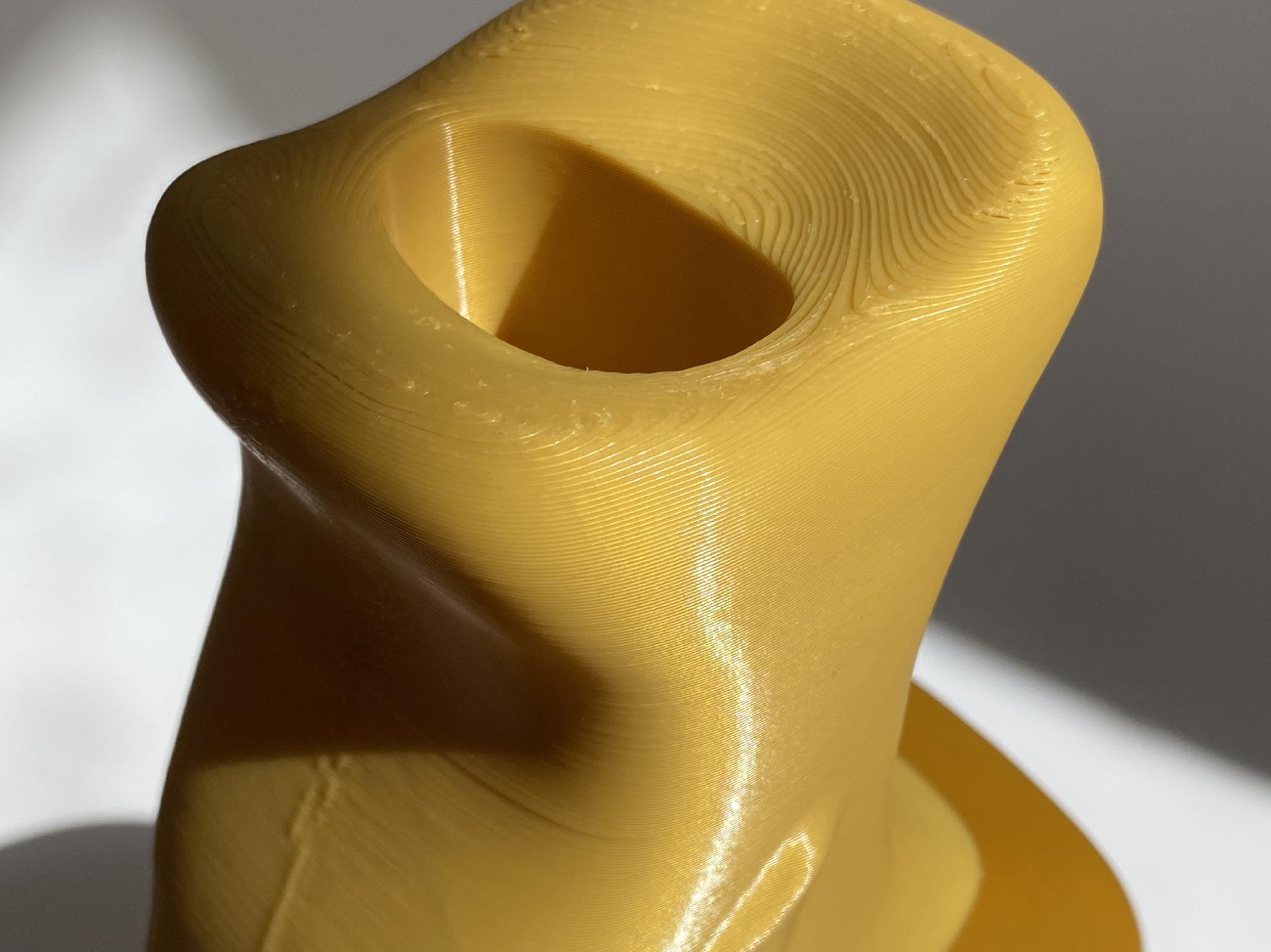 3D printed yellow sculpture highlighting innovative form and texture by visual artist Soorin Shin from Wobbly Digital.