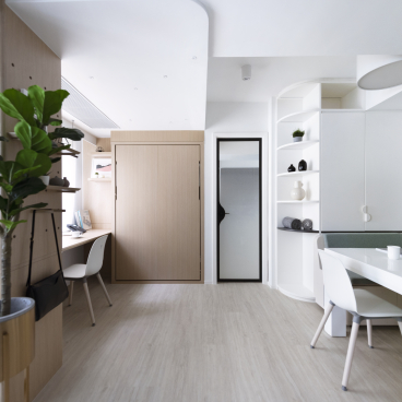 Contemporary live/work space featuring a modern desk, minimalist decor, and a cozy atmosphere for remote work.