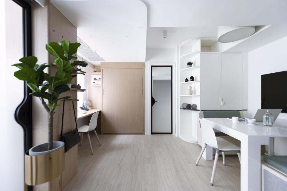 Contemporary live/work space featuring a modern desk, minimalist decor, and a cozy atmosphere for remote work.