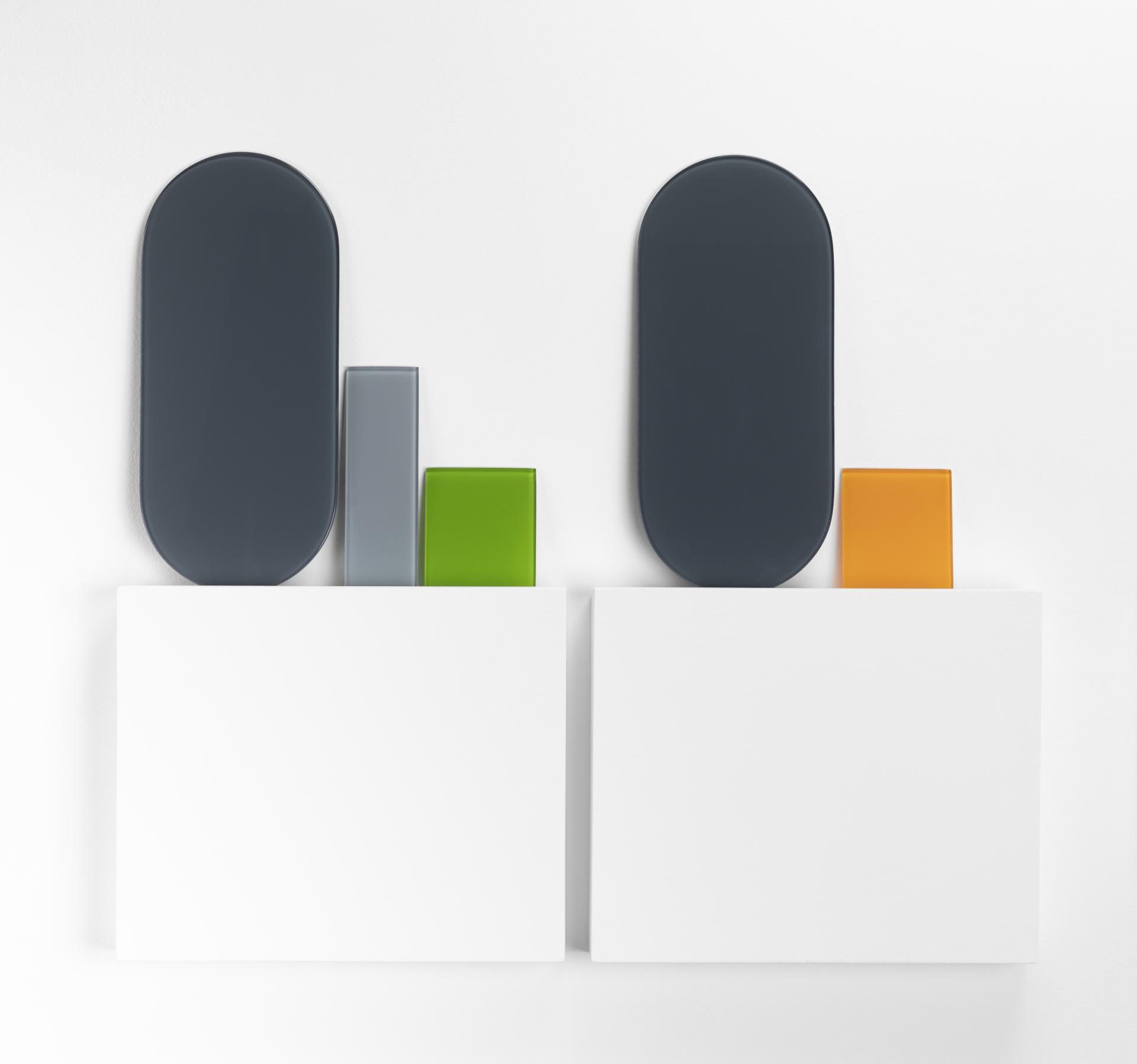 Colorful abstract sculptures displayed against a white background at the Future Icons Selects exhibition during London Craft Week 2023.