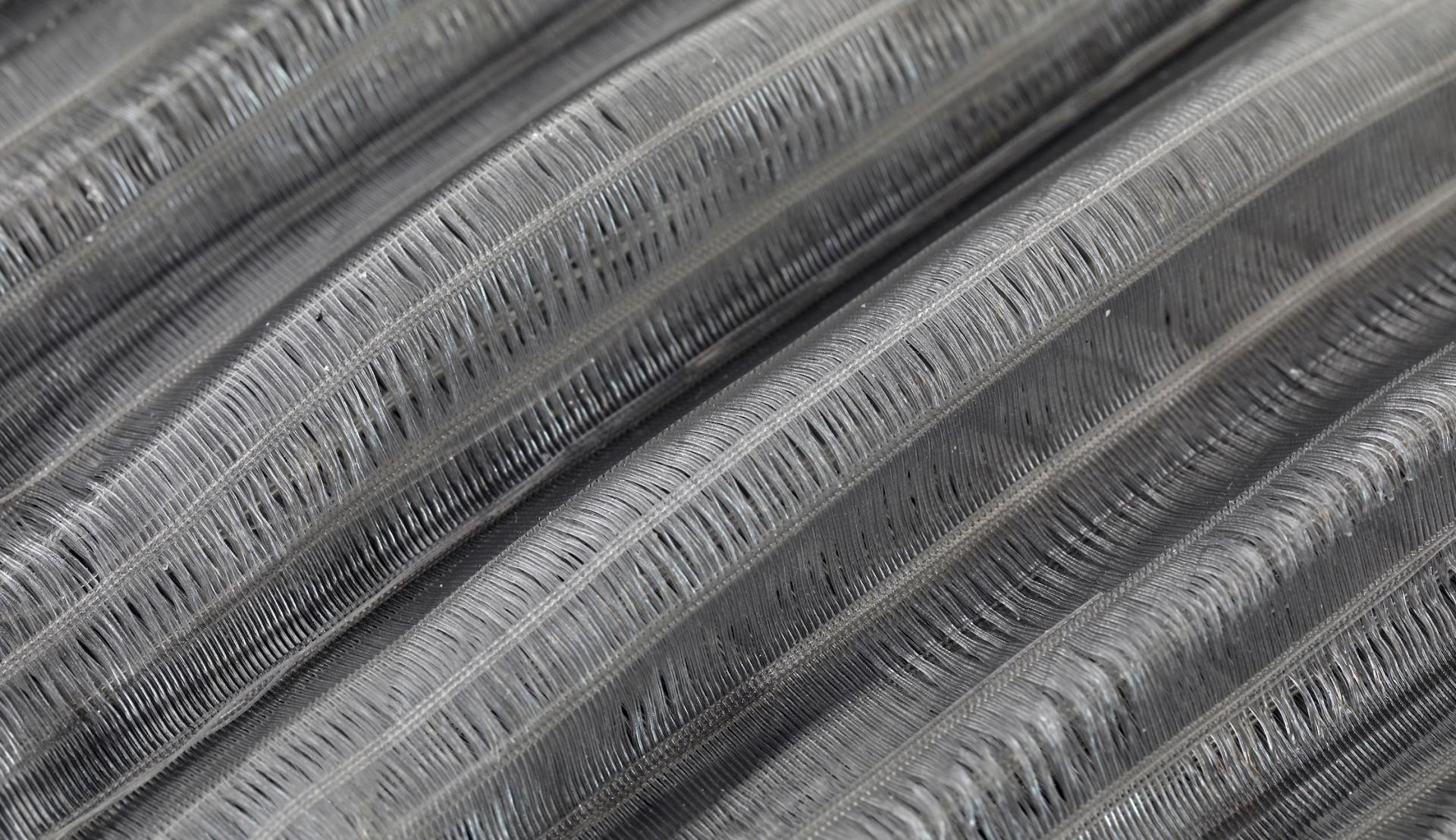 Innovative textured material showcasing a unique dimensional design, exemplifying new material advancements in technology and sustainability.