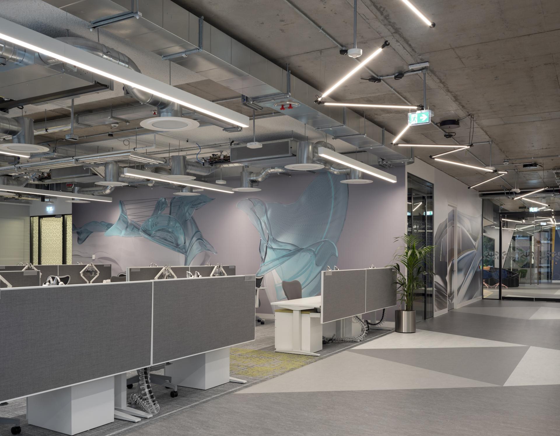 Modern office interior at Autodesk Dublin headquarters featuring Martinelli Luce lighting and Henry J Lyons architectural design.