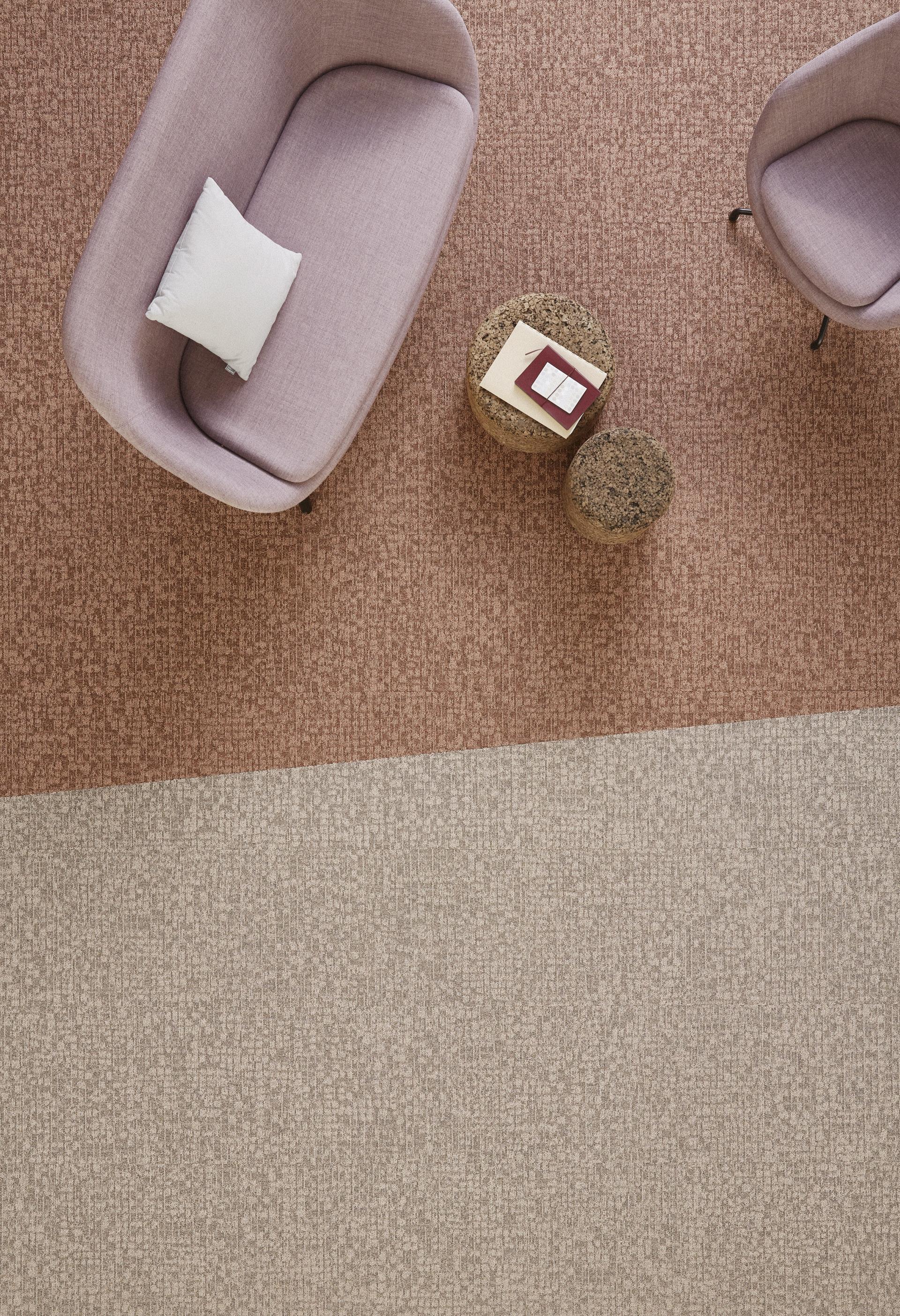 Stylish living space showcasing Tarkett DESSO Orchard carpet with subtle dotted pattern and eco-friendly design elements.