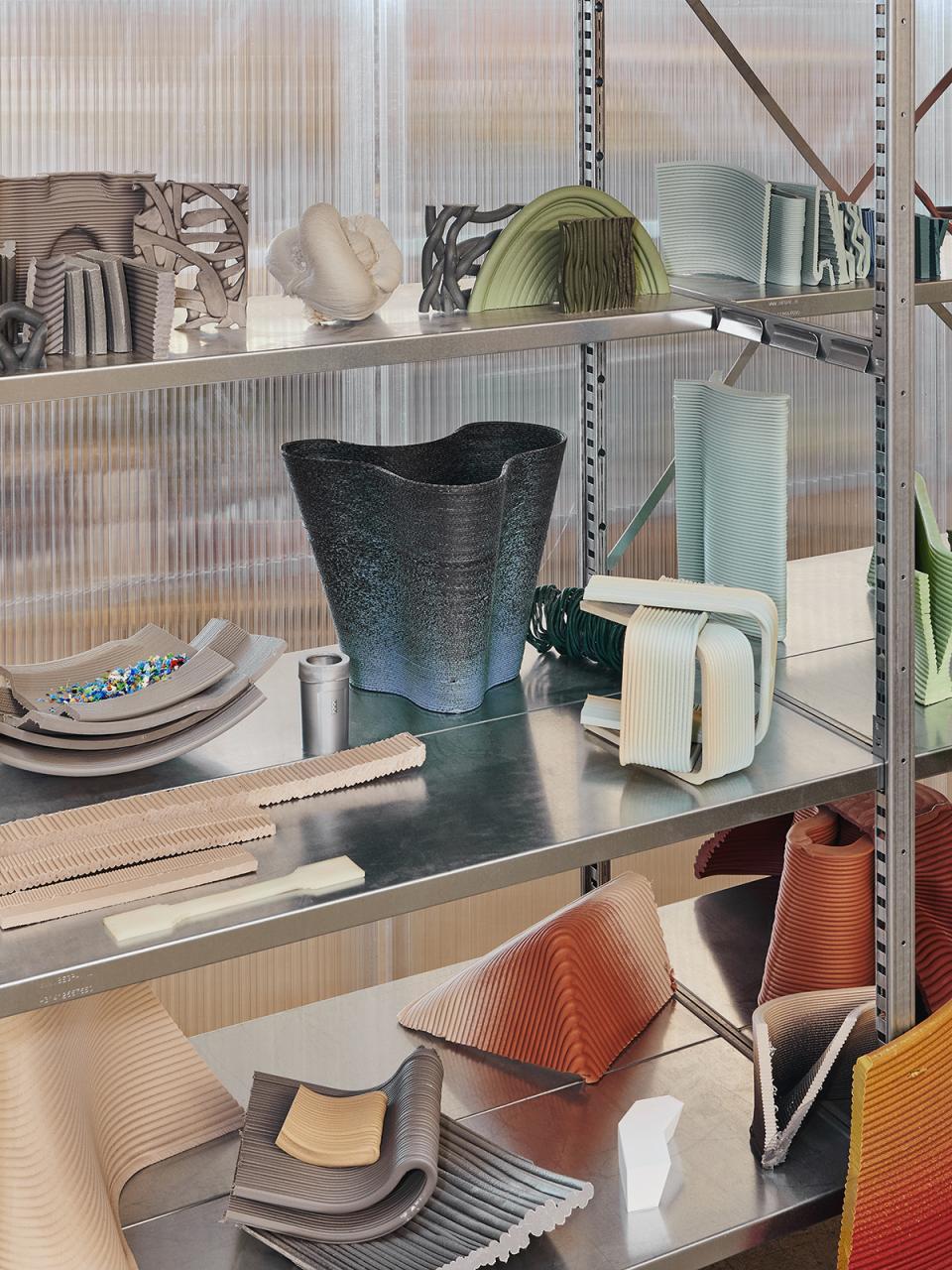 Collection of colorful, zero-waste chair prototypes and materials from The New Raw's Ermis Chair design project.