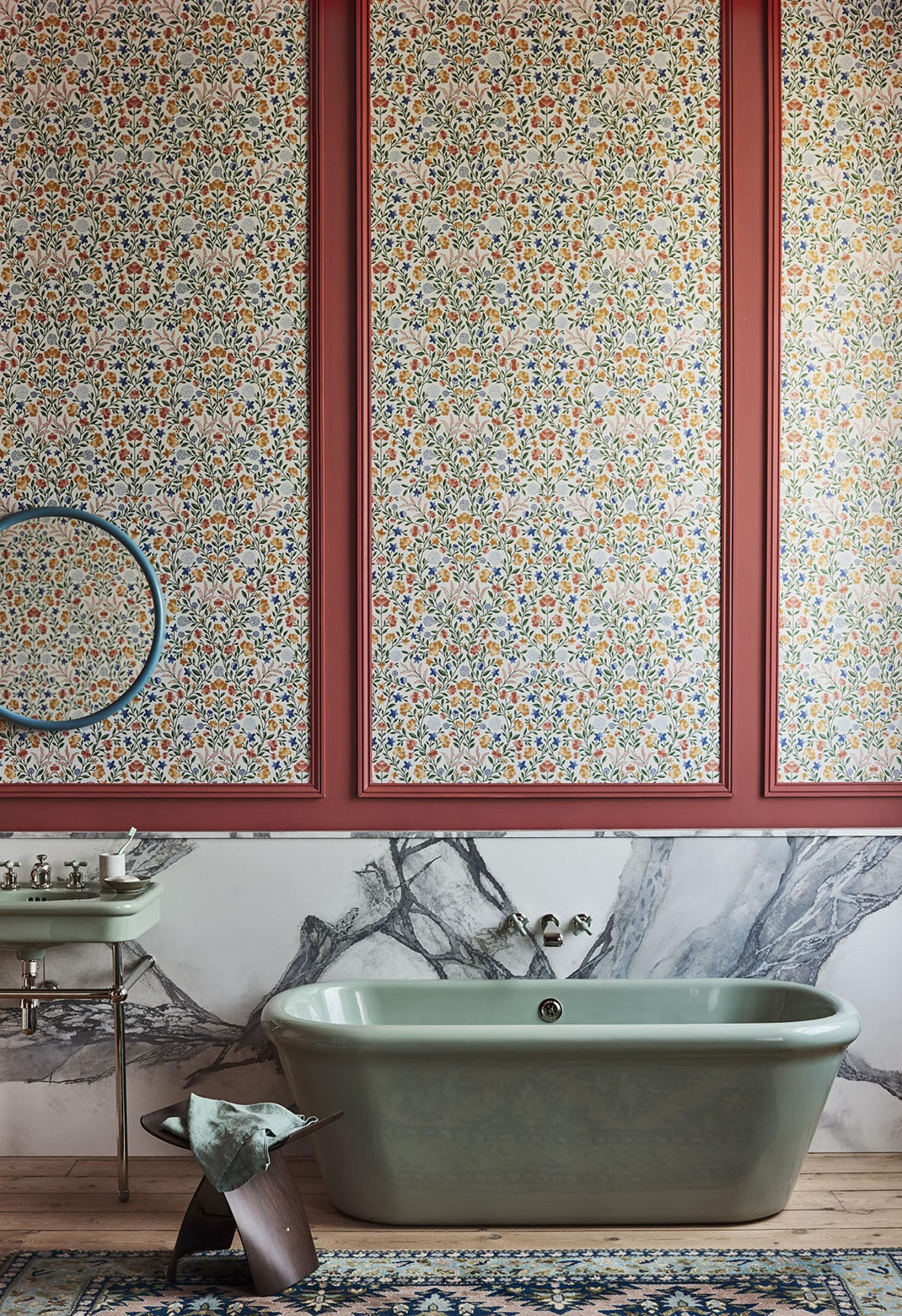 Elegant British bathroom featuring a vintage tub and floral wallpaper, part of Cole & Son's royal residences collection.