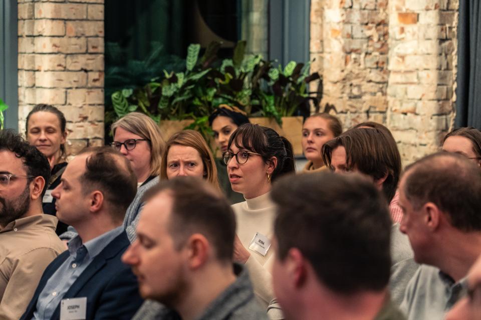 Audience members engaged in discussion at the Material Source Studio seminar on sustainability in Manchester.