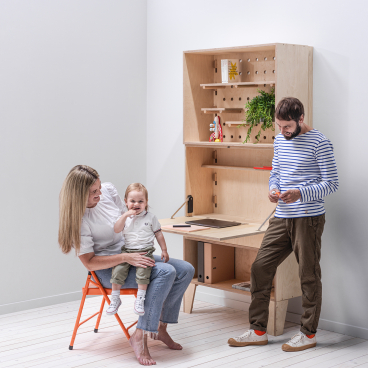 Bespoke modular workspace featuring a mother and child with a man, highlighting flexible family-friendly design in Manchester.