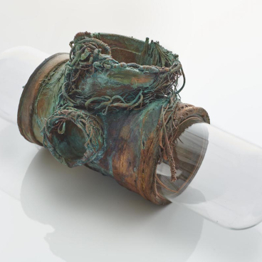 Katrin Spranger's Aquatopia sculpture blends traditional water storage materials with artistic design, showcasing unique textures and forms.