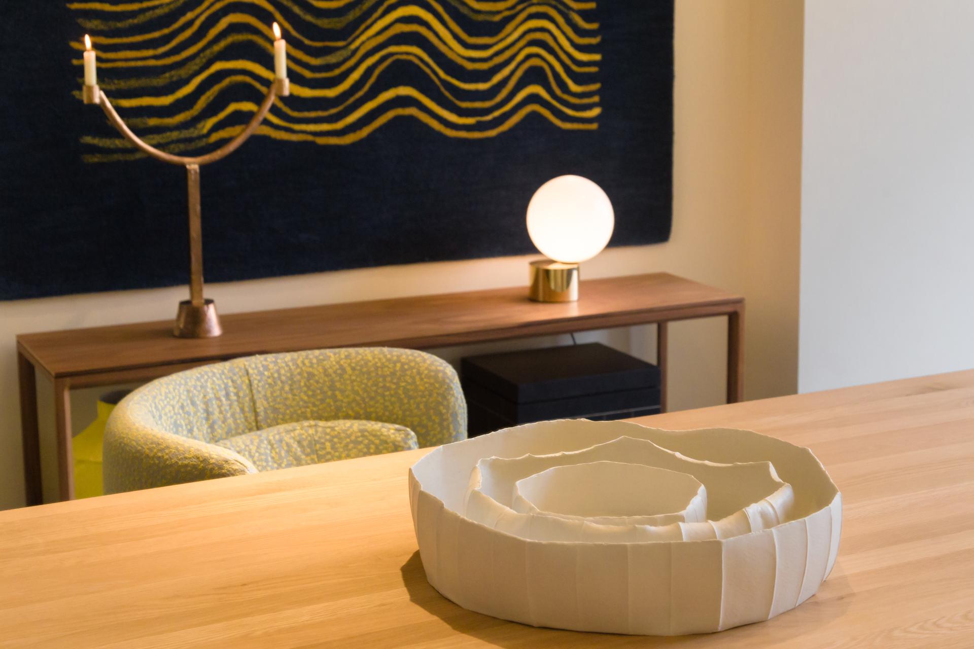 Elegant interior of SCP Pimlico Road showroom featuring modern decor, unique bowl centerpiece, and stylish furniture.