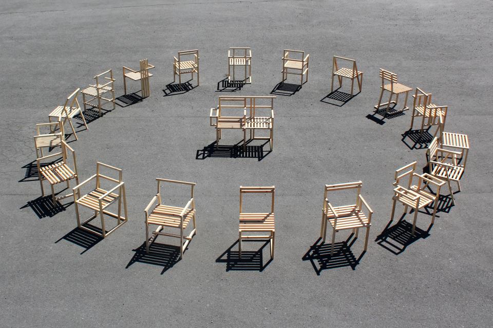A circular arrangement of various wooden chairs constructed using 27mm square section timber during lockdown.
